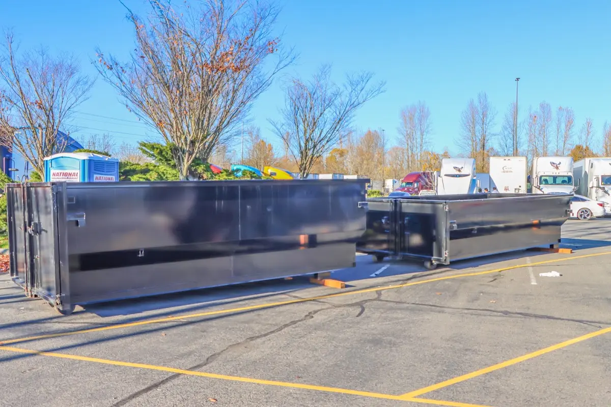 Professional dumpster rental service with roll-off container on residential driveway in Tinley Park